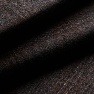 Close-up of dark gray wool fabric in soft folds, with a subtle brown and rust check pattern