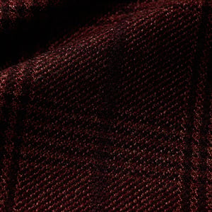 Close-up of dark burgundy woolen twill fabric with a subtle black overcheck pattern