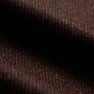 Close-up of dark brown woolen fabric with a fine ribbed texture and soft folds