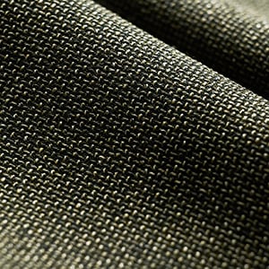 Close-up of a dark olive-green woven wool fabric with a fine, tight texture, softly folded