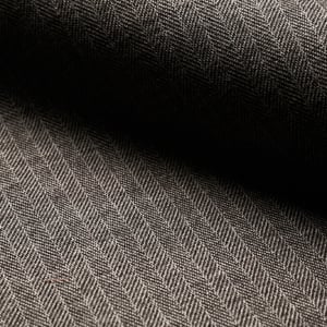 Close-up of a gray-brown herringbone wool fabric with fine light stripes and soft folds