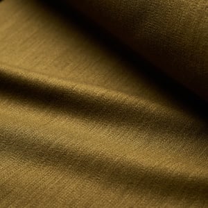 Close-up of olive-brown woven fabric with soft folds and a fine texture