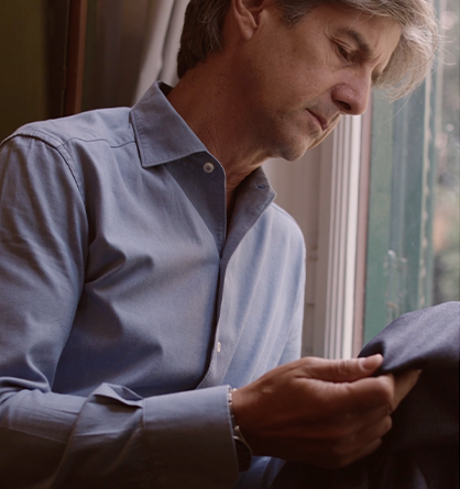 Man looking at fabric