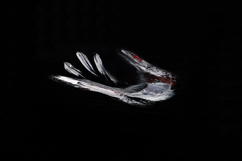 White and red brushstrokes forming an open hand with spread fingers on a black background